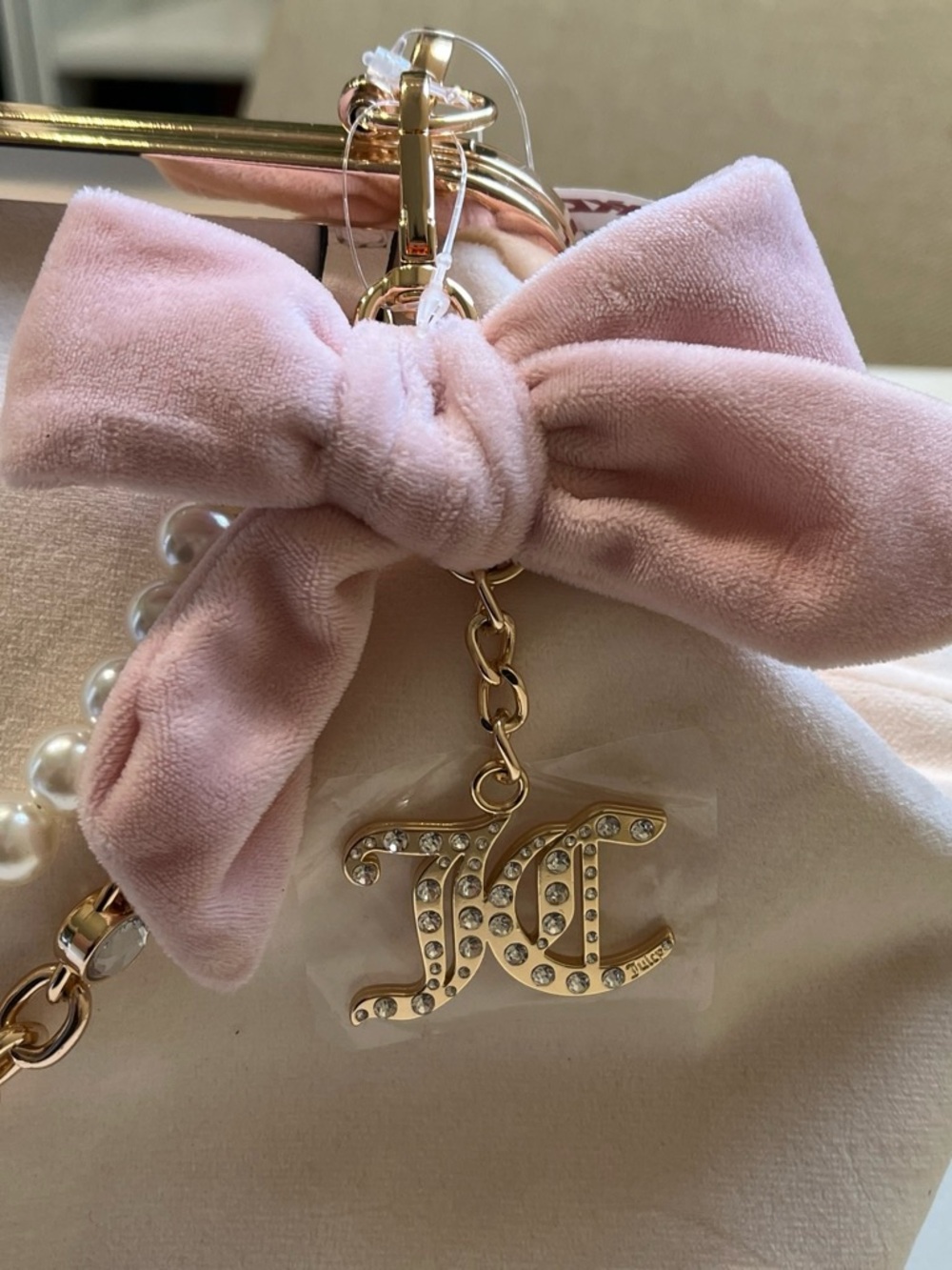 Juicy Couture Pink Velvet Bow Bag Charm with Gold Crystal JC Logo